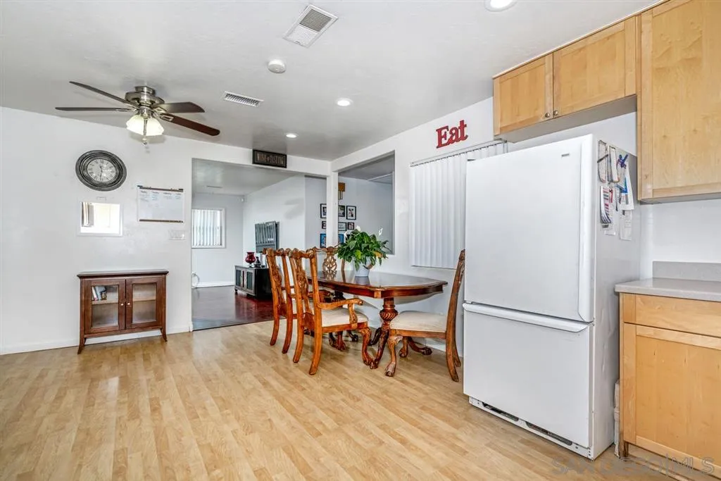 8311 Sunset Road Lakeside, CA 92040 - Photo 5 of 25 a kitchen with stainless steel appliances a refrigerator and a fireplace