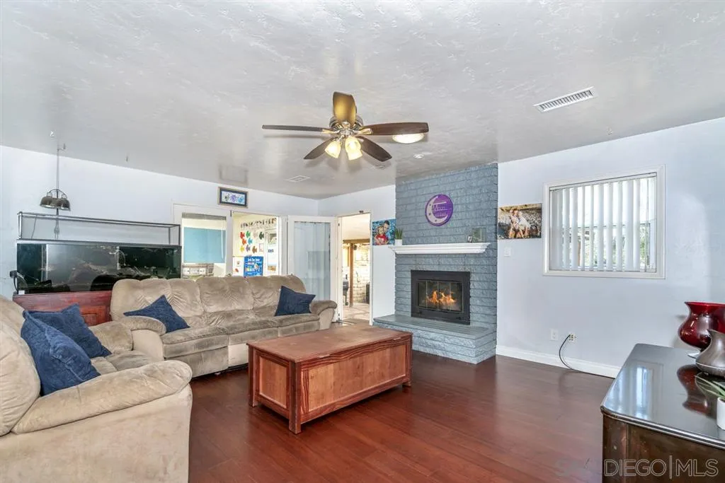 8311 Sunset Road Lakeside, CA 92040 - Photo 7 of 25 a living room with furniture fireplace and a window