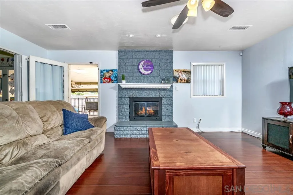 8311 Sunset Road Lakeside, CA 92040 - Photo 8 of 25 a living room with furniture and a fireplace