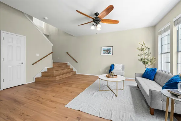 a view of a livingroom with furniture and wooden floor