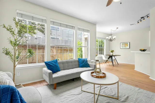 a living room with furniture and a large window