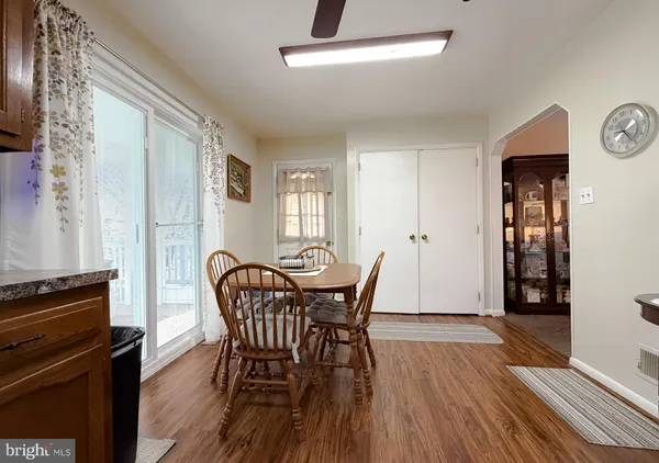 a view of a dining room with furniture and window