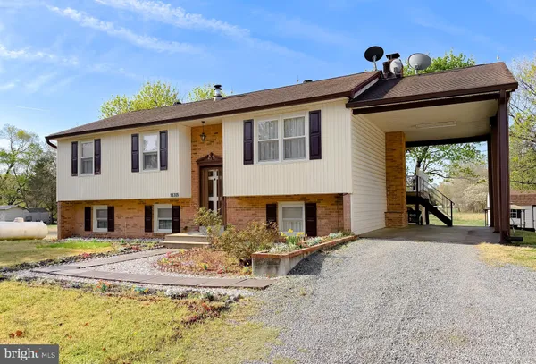 front view of a house with a patio