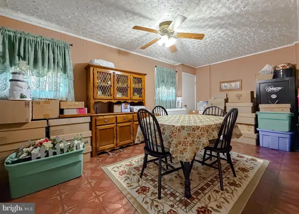 a utility room with a stove a sink and a refrigerator