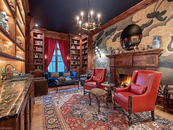 a view of a living room and a chandelier