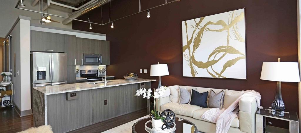 8110 Park Lane, Unit 901 Dallas, TX 75231 - Photo 8 of 18 a living room with furniture and wooden floor