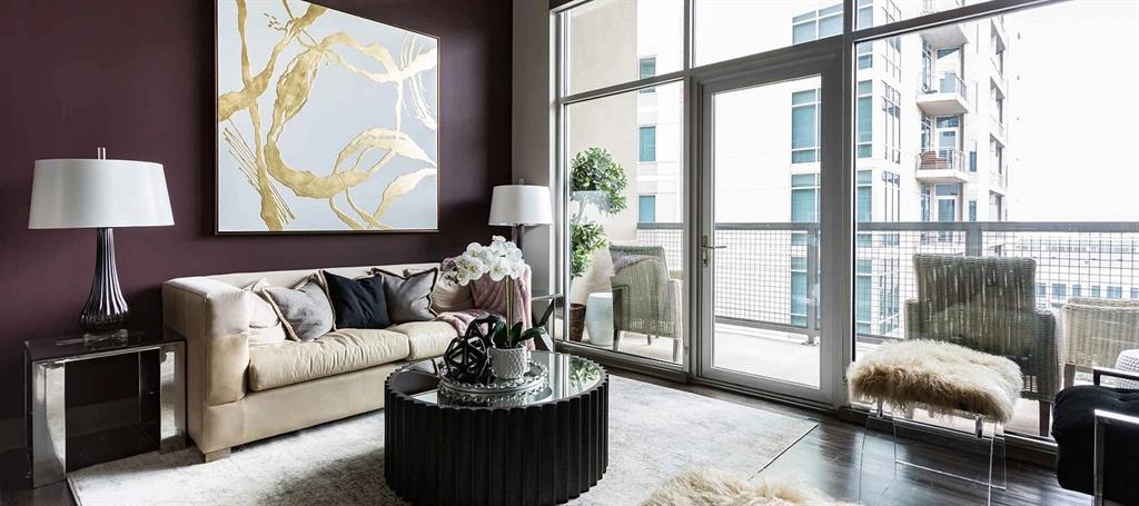 8110 Park Lane, Unit 901 Dallas, TX 75231 - Photo 10 of 18 a living room with furniture and a floor to ceiling window