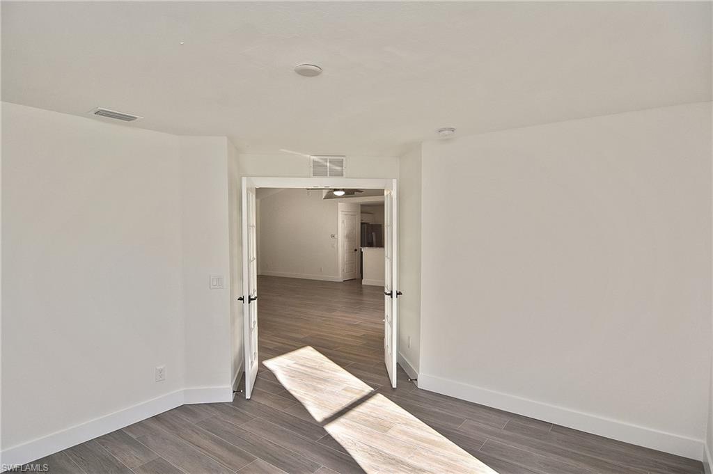 785 Homestead Road South Lehigh Acres, FL 33974 - Photo 41 of 49 a view of a room with wooden floor