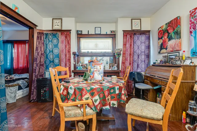 a dining room with furniture and wooden floor