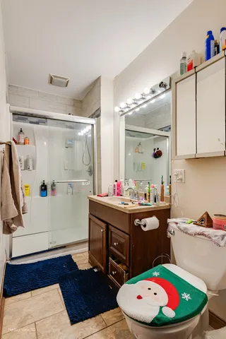 a room with a white cabinets and white appliances