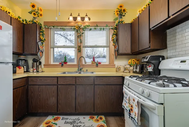 a kitchen with a sink stove and cabinets
