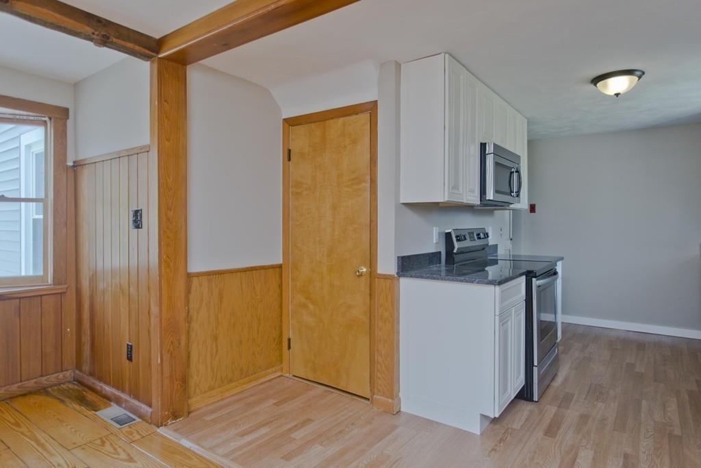 67 Colemore Street Feeding Hills, MA 01030 - Photo 11 of 42 a kitchen with stainless steel appliances granite countertop a refrigerator and a stove top oven