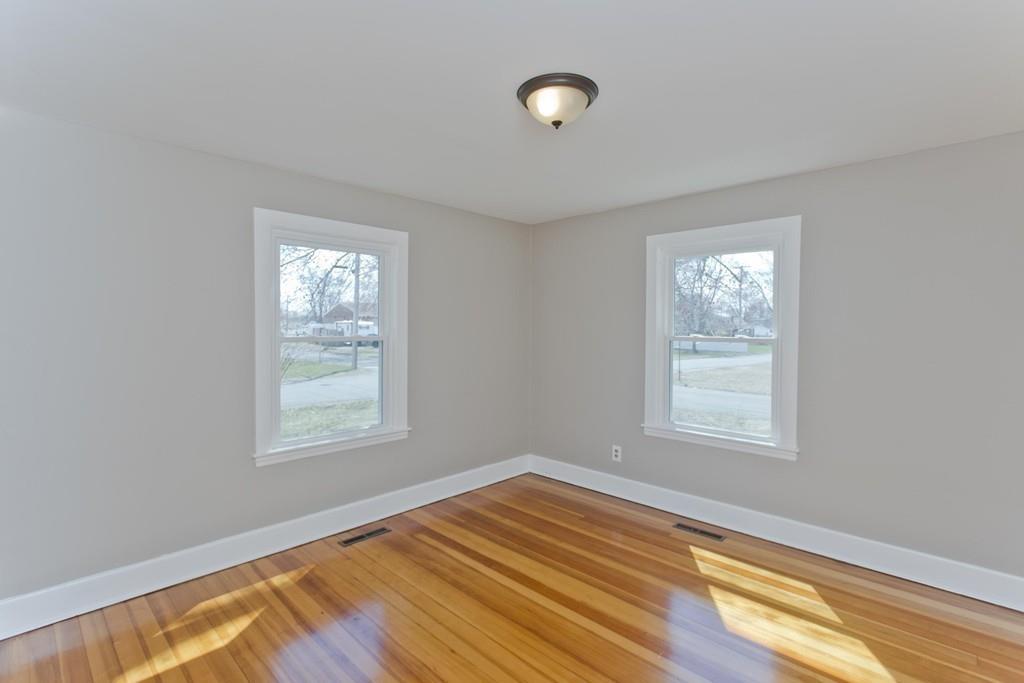 67 Colemore Street Feeding Hills, MA 01030 - Photo 12 of 42 an empty room with wooden floor and windows