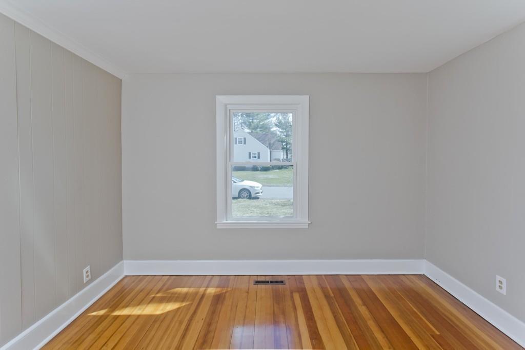 67 Colemore Street Feeding Hills, MA 01030 - Photo 13 of 42 a view of an empty room with wooden floor and a window