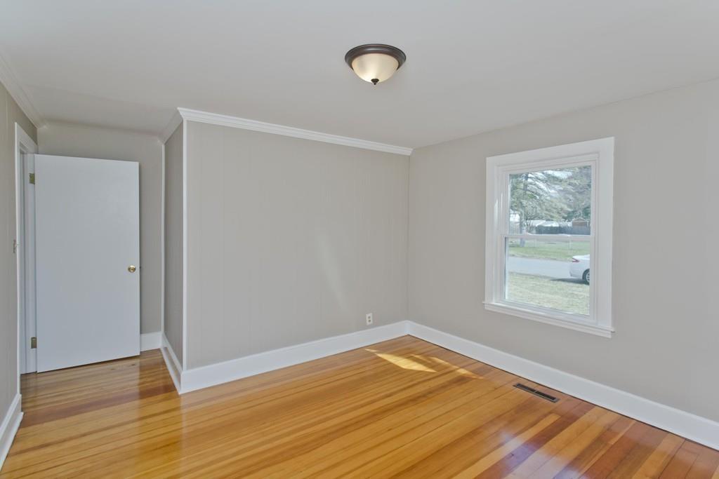 67 Colemore Street Feeding Hills, MA 01030 - Photo 17 of 42 an empty room with wooden floor and windows