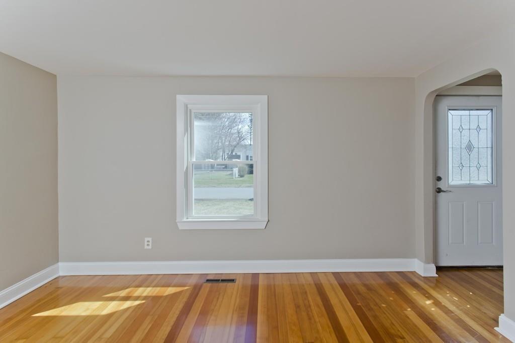 67 Colemore Street Feeding Hills, MA 01030 - Photo 36 of 42 an empty room with wooden floor and windows
