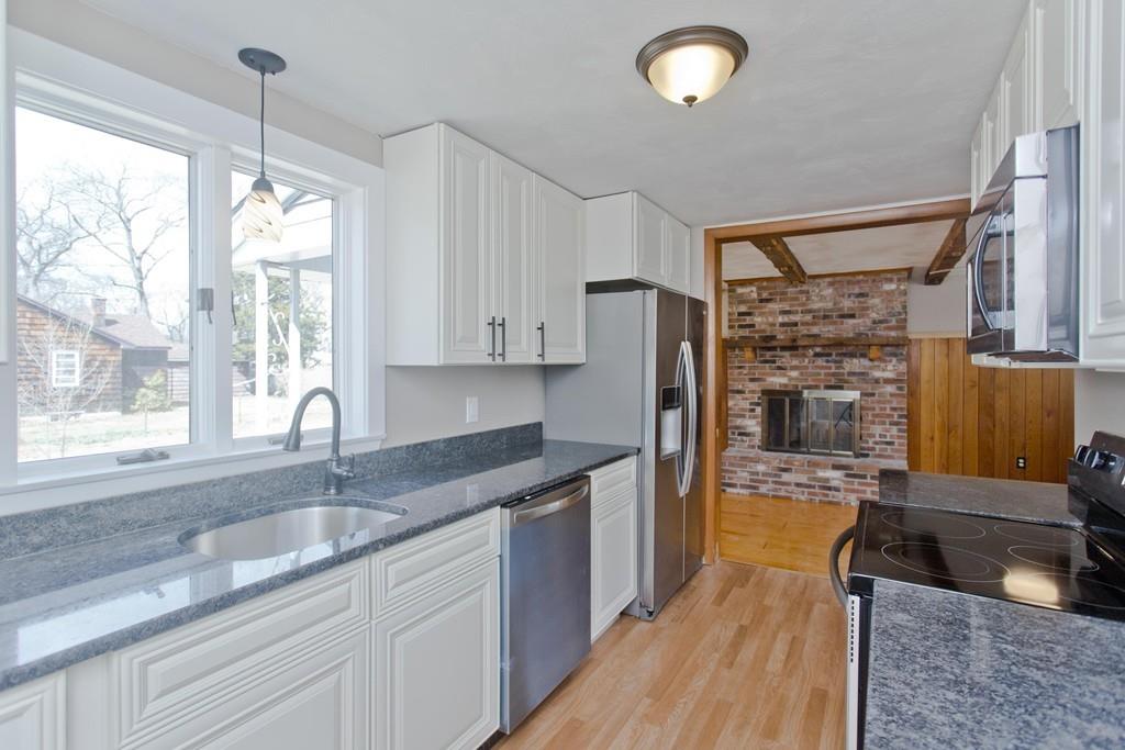 67 Colemore Street Feeding Hills, MA 01030 - Photo 7 of 42 a kitchen with stainless steel appliances granite countertop a sink stove and refrigerator