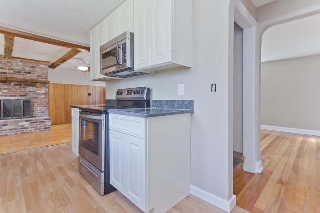 67 Colemore Street Feeding Hills, MA 01030 - Photo 10 of 42 a kitchen with stainless steel appliances granite countertop a stove and a refrigerator