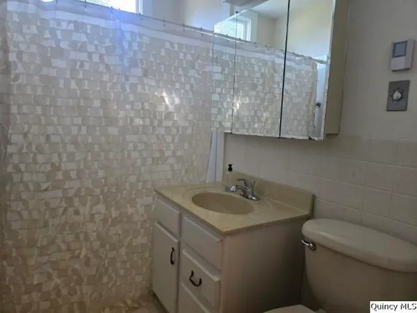 a bathroom with a sink and a toilet