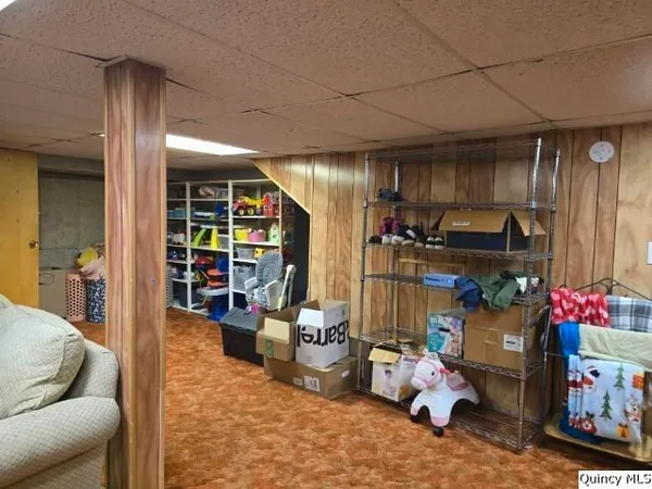 a garage room with furniture and a large window