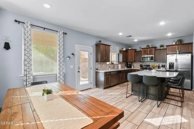 a spacious bedroom with a bed and a table