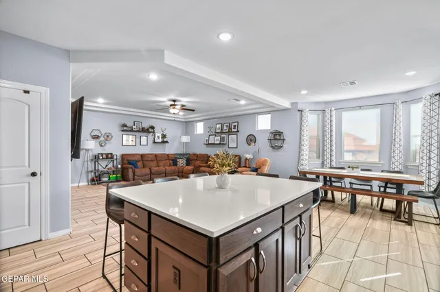 a living room with furniture a rug and a window