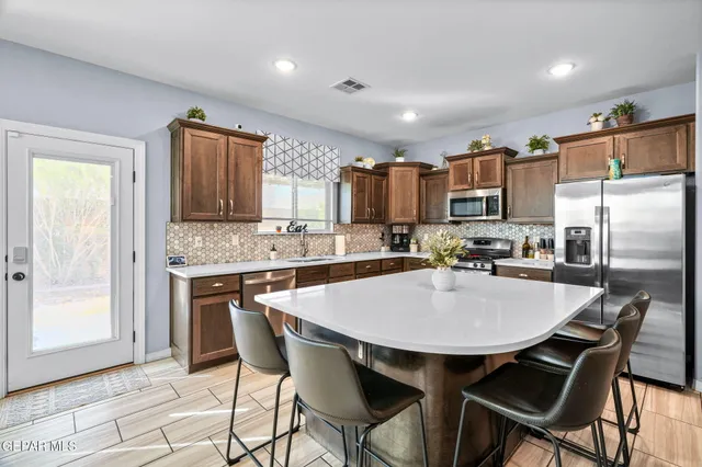 a bedroom with a large bed and a large window