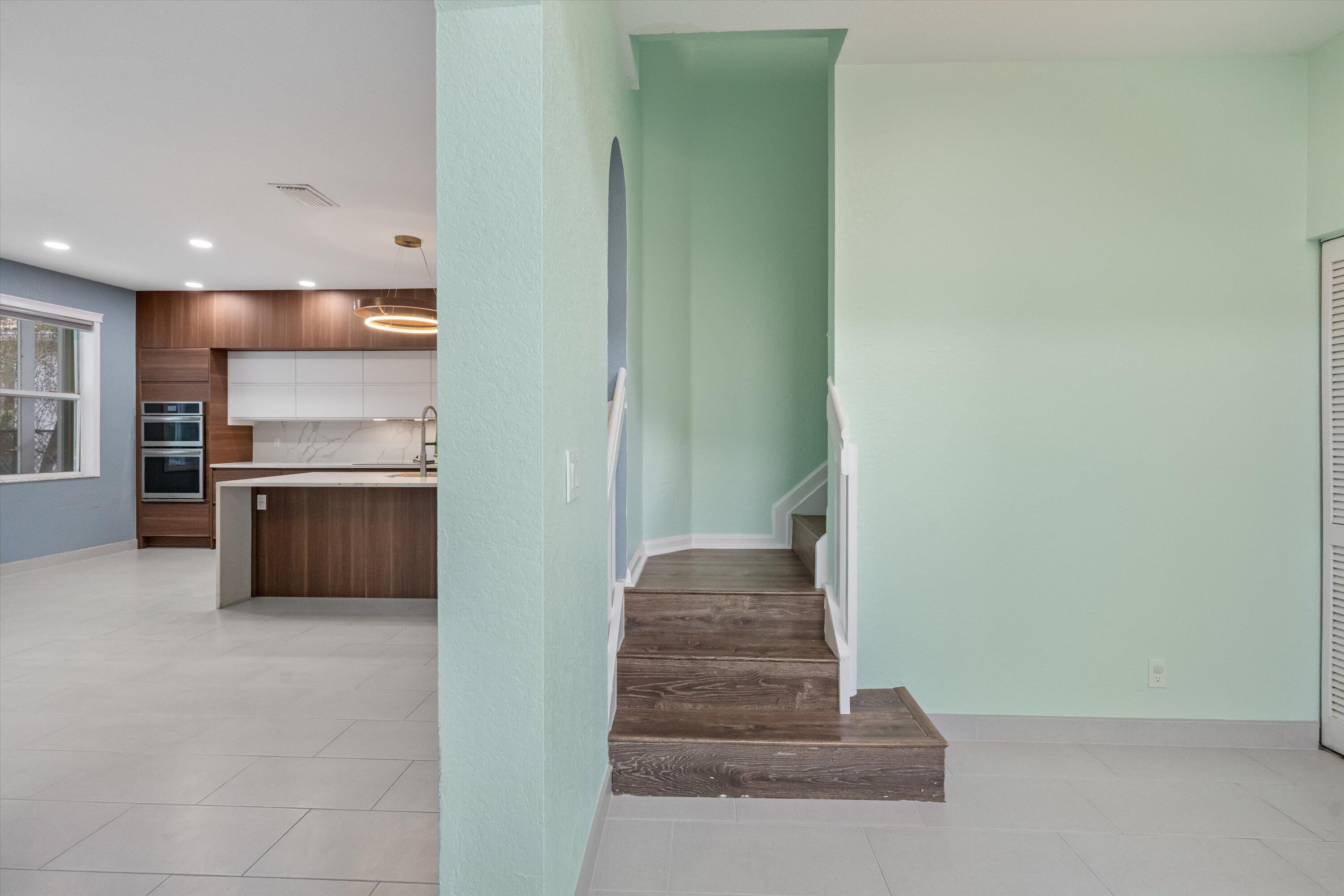 1222 Rose Gate Boulevard Riviera Beach, FL 33404 - Photo 13 of 29 a view of a kitchen with a sink and refrigerator