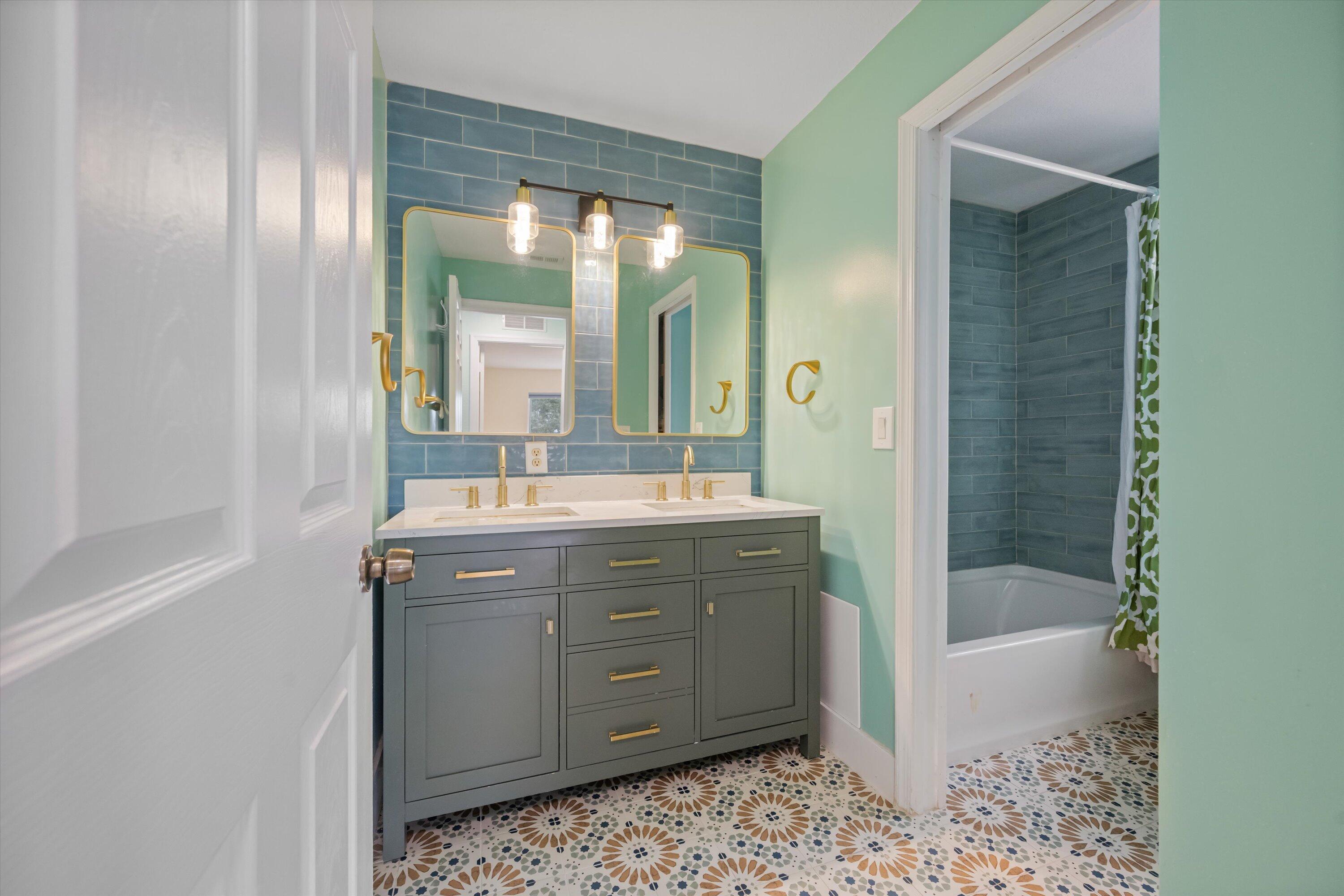 1222 Rose Gate Boulevard Riviera Beach, FL 33404 - Photo 21 of 29 a bathroom with a sink a toilet and shower