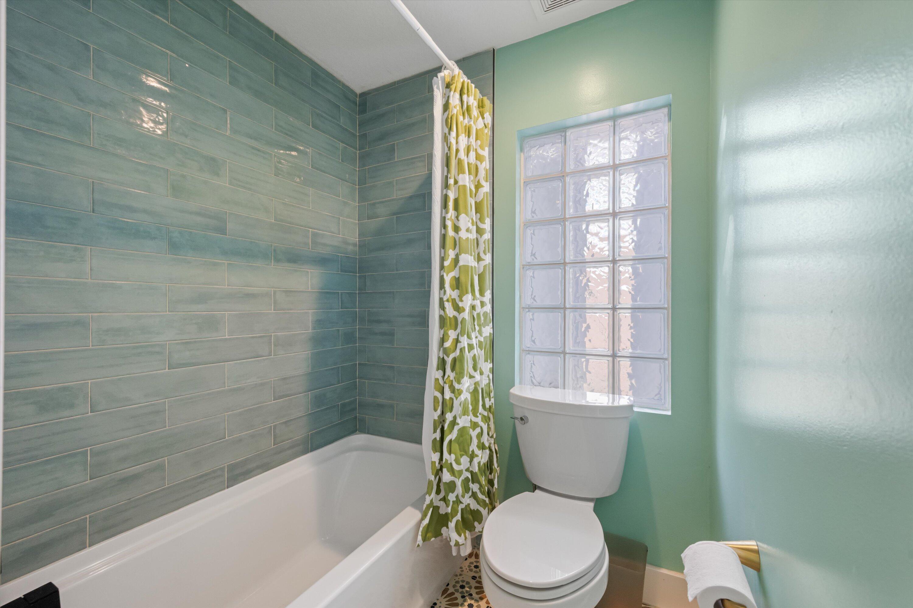 1222 Rose Gate Boulevard Riviera Beach, FL 33404 - Photo 22 of 29 a bathroom with a toilet and shower