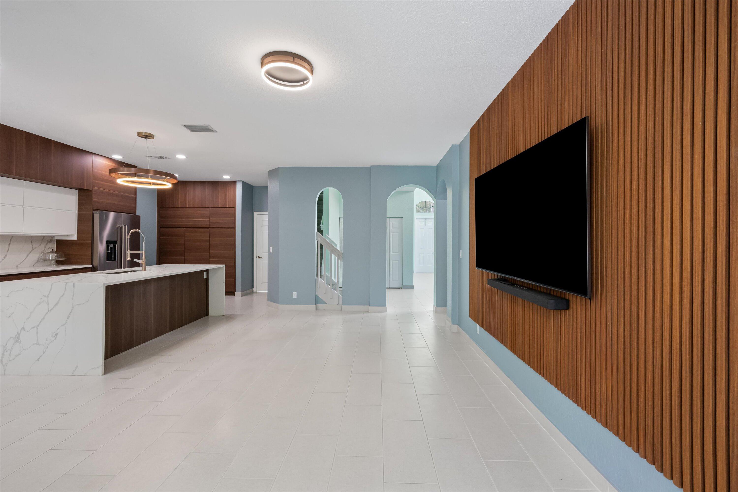 1222 Rose Gate Boulevard Riviera Beach, FL 33404 - Photo 3 of 29 a view of a kitchen with a sink and a fireplace