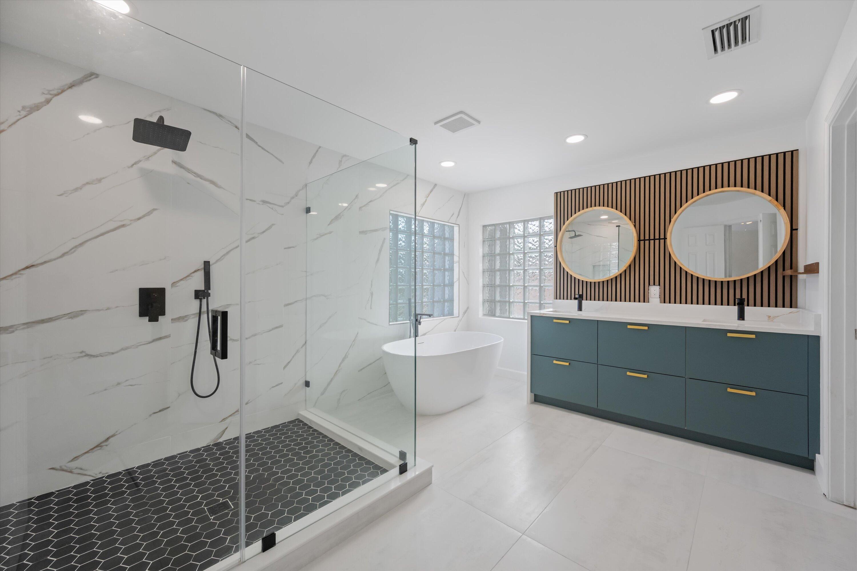 1222 Rose Gate Boulevard Riviera Beach, FL 33404 - Photo 4 of 29 a bathroom with a double vanity sink toilet mirror and shower