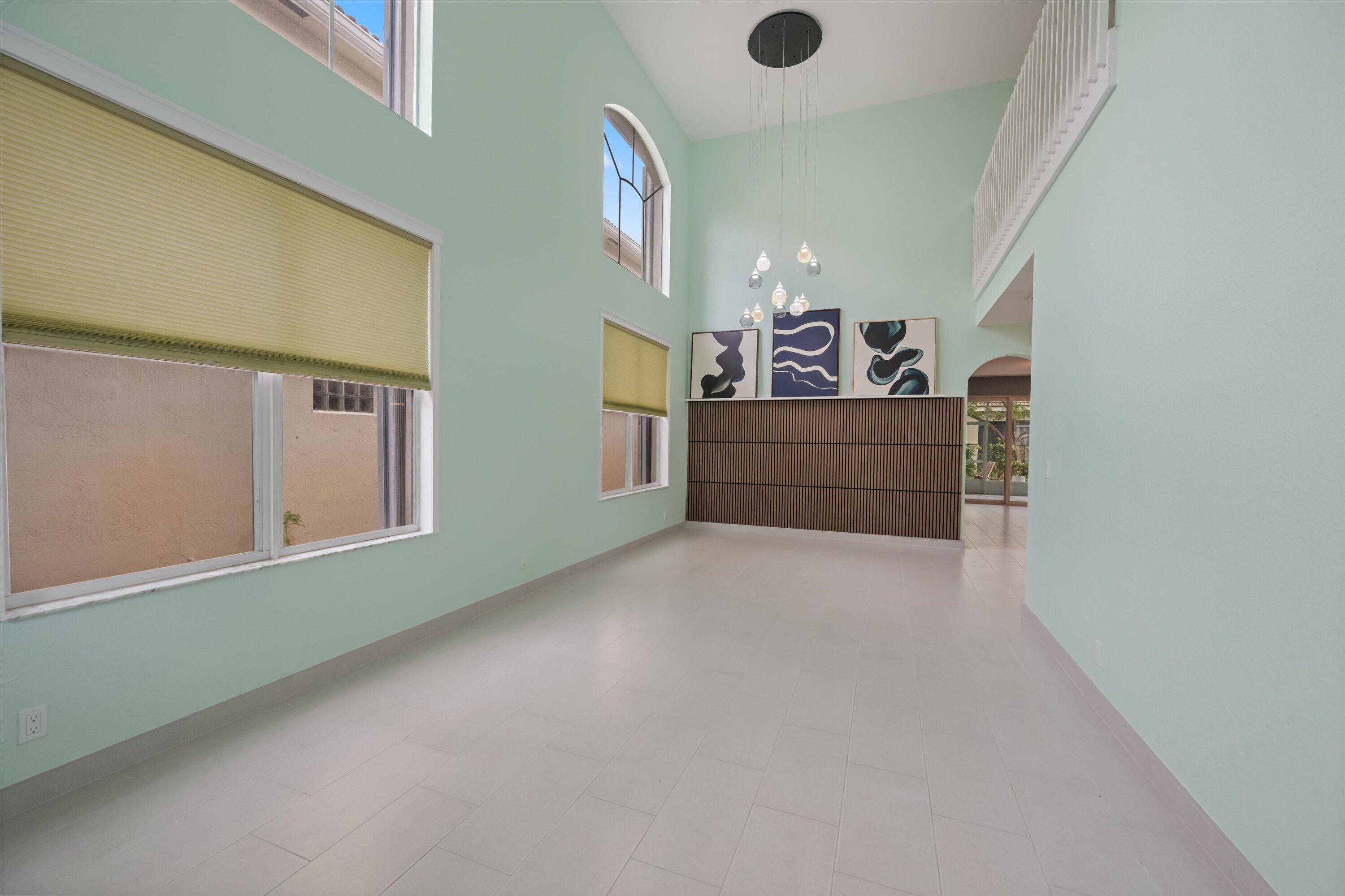 1222 Rose Gate Boulevard Riviera Beach, FL 33404 - Photo 7 of 29 a view of a hallway with stairs