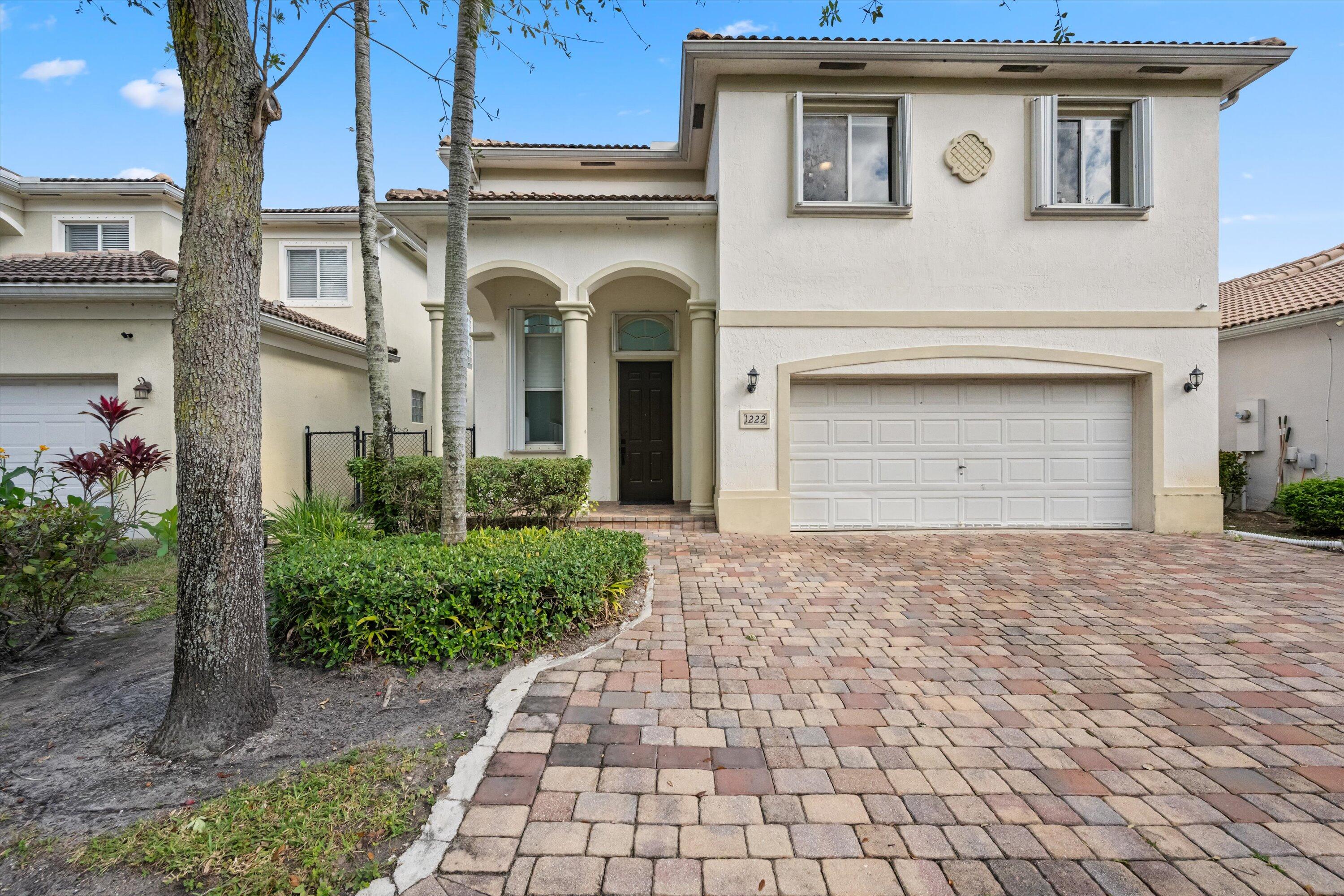 1222 Rose Gate Boulevard Riviera Beach, FL 33404 - Photo 10 of 29 a front view of a house