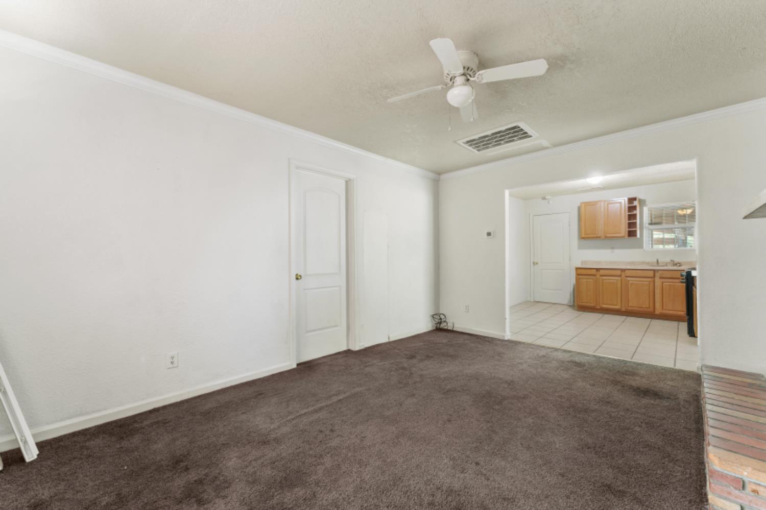 5192 Chestnut Road Olivehurst, CA 95961 - Photo 7 of 24 a view of an empty room with a ceiling fan