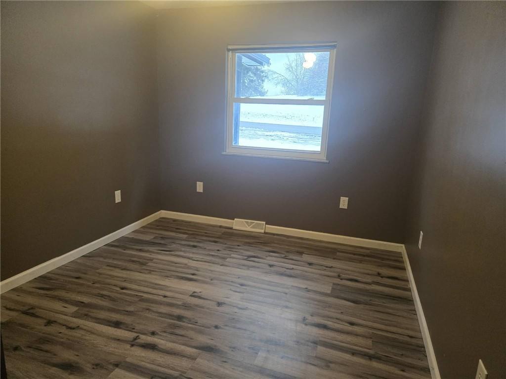 504 Queenstown Road Karns City, PA 16041 - Photo 11 of 18 a view of a room with wooden floor and window