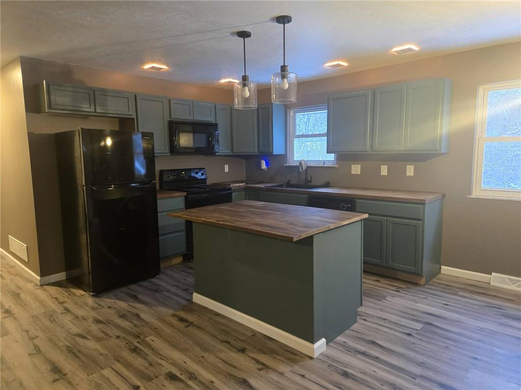 504 Queenstown Road Karns City, PA 16041 - Photo 4 of 18 a kitchen with stainless steel appliances granite countertop a sink and a refrigerator