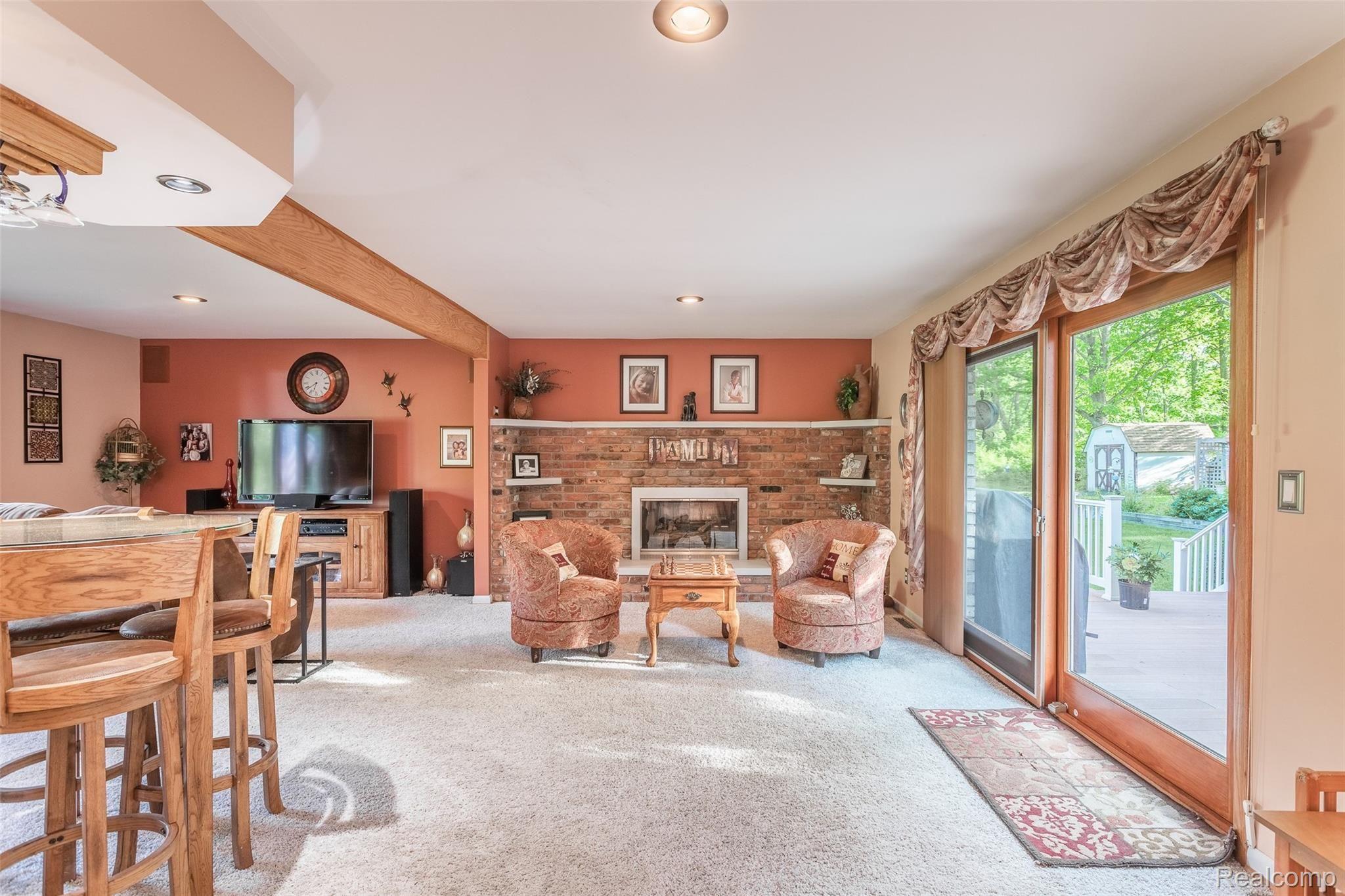 905 Gulley Road Howell, MI 48843 - Photo 9 of 52 Family room with gas fireplace