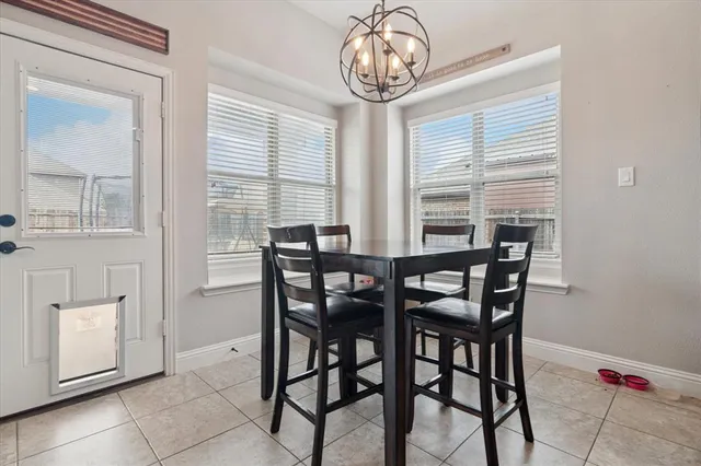 a view of a dining room with furniture and window