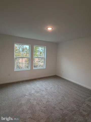 a bathroom with double vanity sink and mirror
