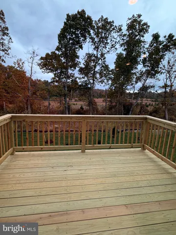 a view of a kitchen with a sink and a large window
