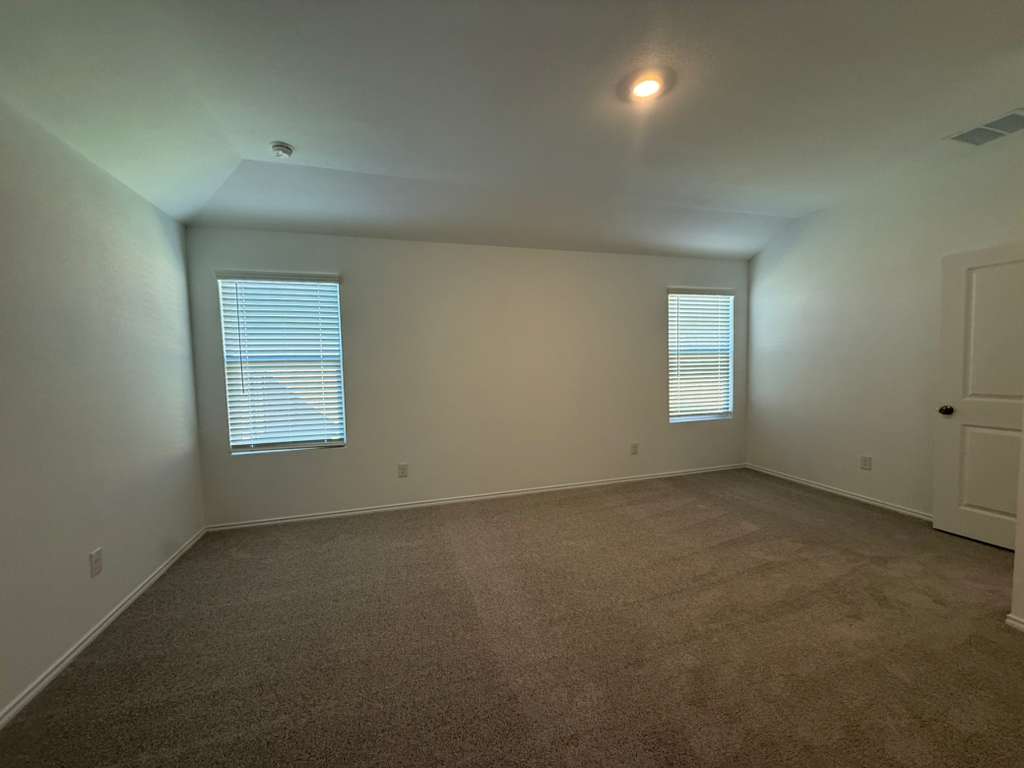 569 Sormonne Loop Kyle, TX 78640 - Photo 24 of 40 an empty room with a empty space and windows