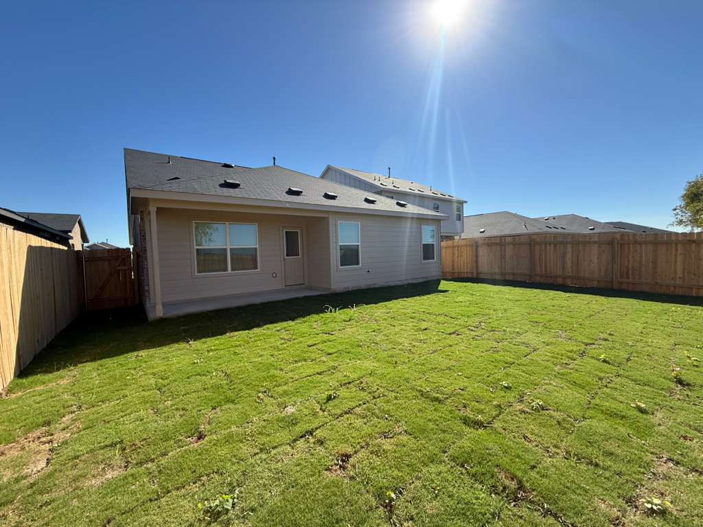 569 Sormonne Loop Kyle, TX 78640 - Photo 34 of 40 a view of a backyard with a tub