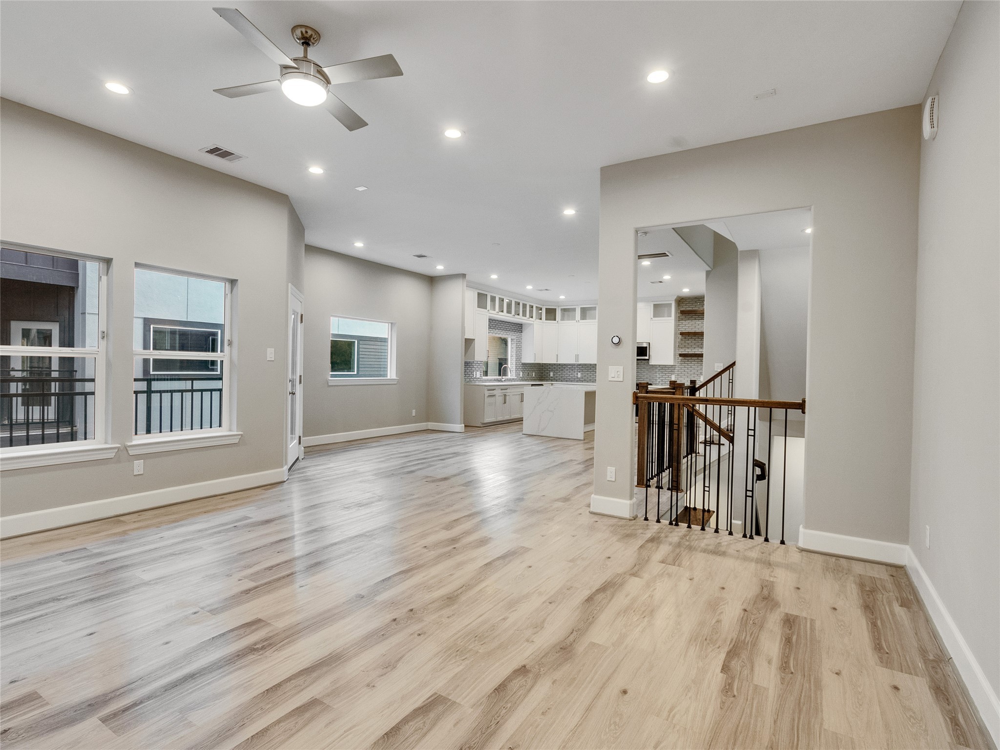 1122 West 16th Street, Unit D Houston, TX 77008 - Photo 12 of 40 an empty room with wooden floor and windows