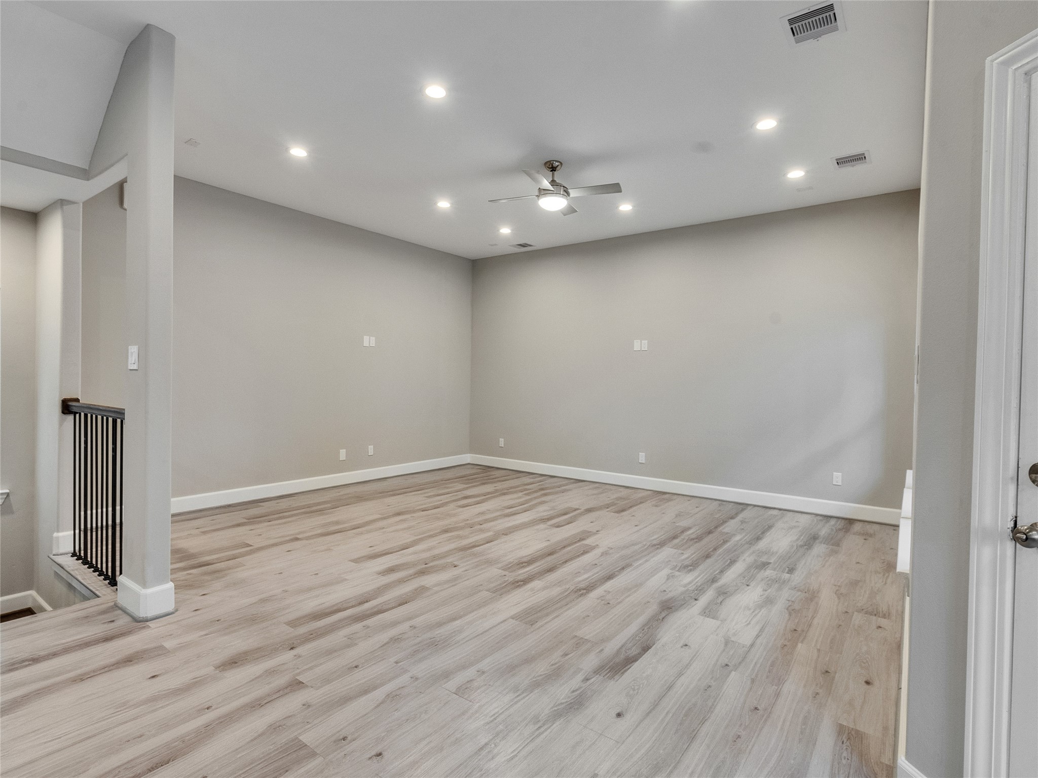 1122 West 16th Street, Unit D Houston, TX 77008 - Photo 14 of 40 an empty room with wooden floor and entrance