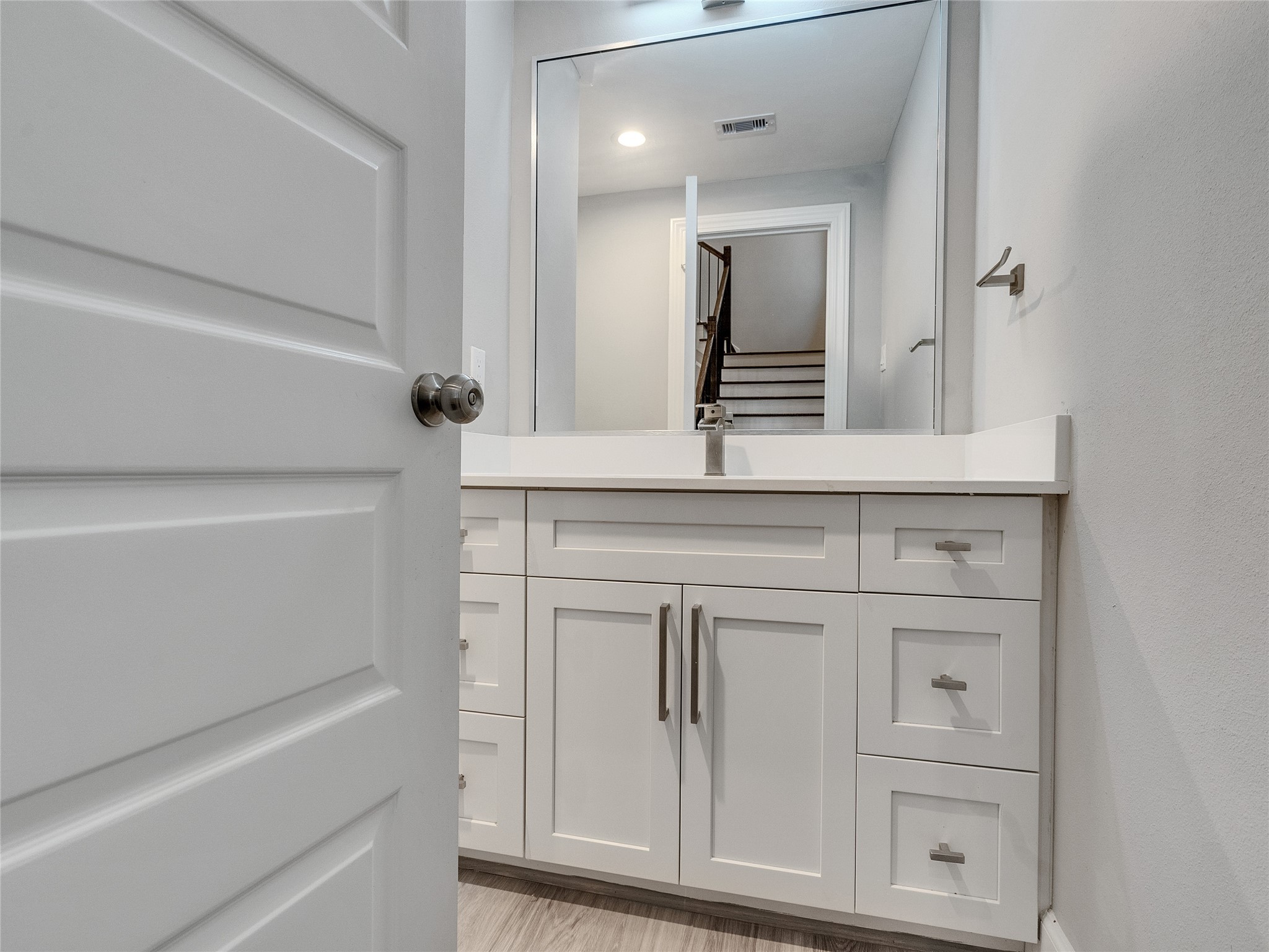 1122 West 16th Street, Unit D Houston, TX 77008 - Photo 24 of 40 a bathroom with a sink vanity and mirror