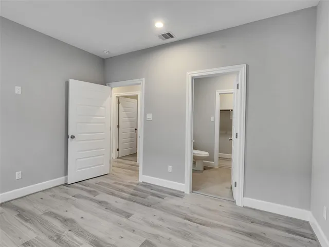 a bathroom with a bathtub sink and mirror