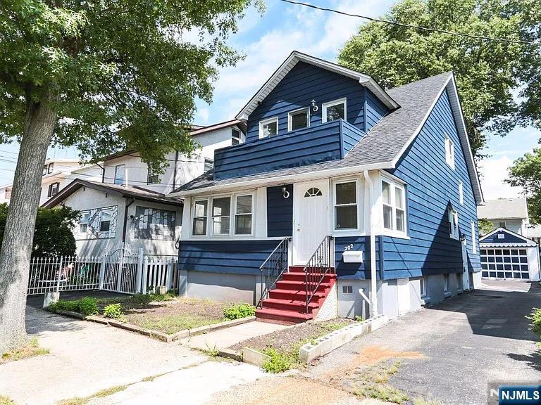 202 Kerrigan Boulevard Newark, NJ 07106 - Photo 5 of 5 a front view of a house with a yard