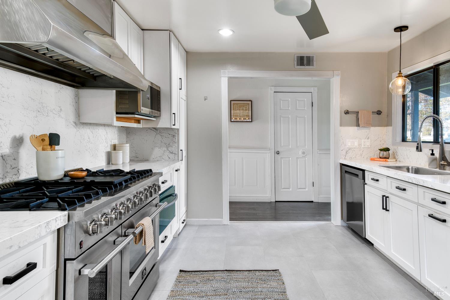 1534 Buchanan Street Novato, CA 94947 - Photo 6 of 30 a kitchen with stainless steel appliances granite countertop a stove and a sink