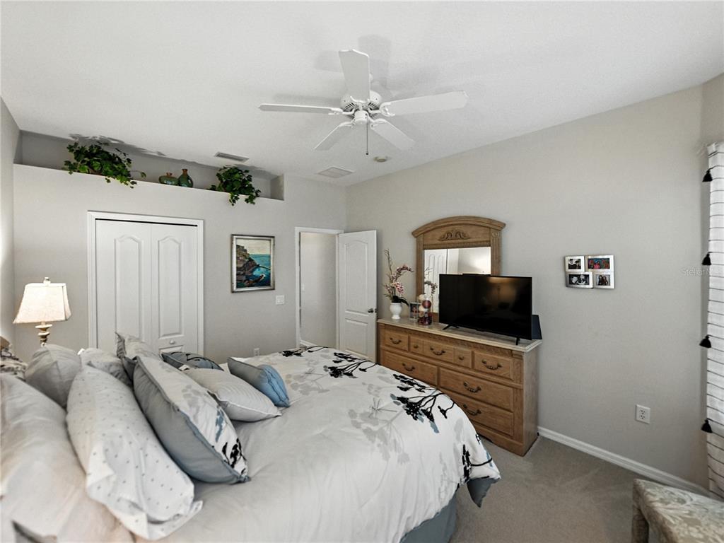 2530 Cross More Street Valrico, FL 33594 - Photo 14 of 61 a bedroom with a bed and a flat screen tv